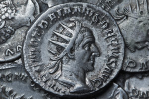 Ancient Roman silver coin showing the portrait of the emperor Ancient Roman silver coin showing the portrait of the emperor